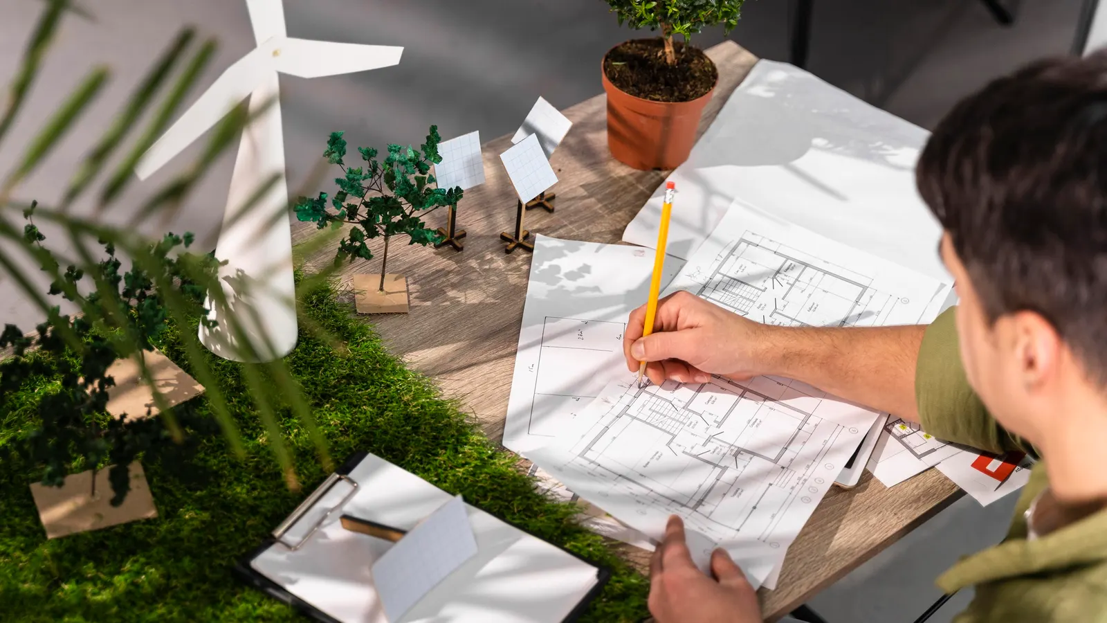Backyard designer sketching an outdoor living plan for a Pilot Point, TX home